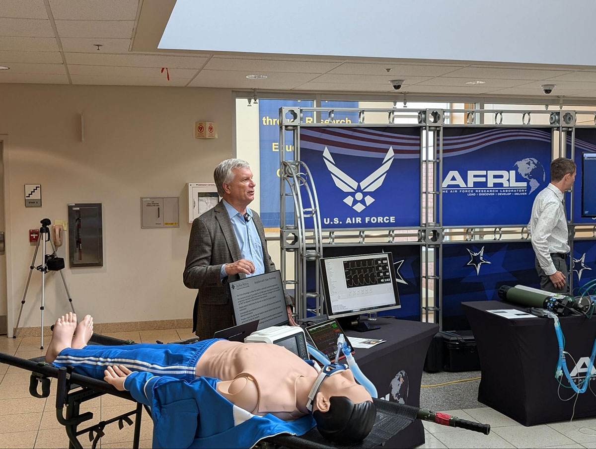 Prof. Richard Branson, MSc, RRT, FAARC, FCC, showcases the advanced mechanical ventilator simulator prototype to stakeholders at Wright-Patterson Air Force Base.