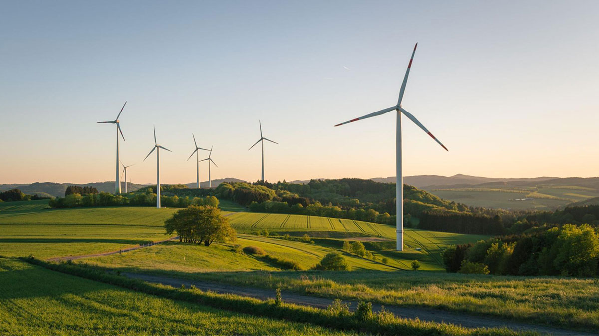 Several wind turbines in a field.