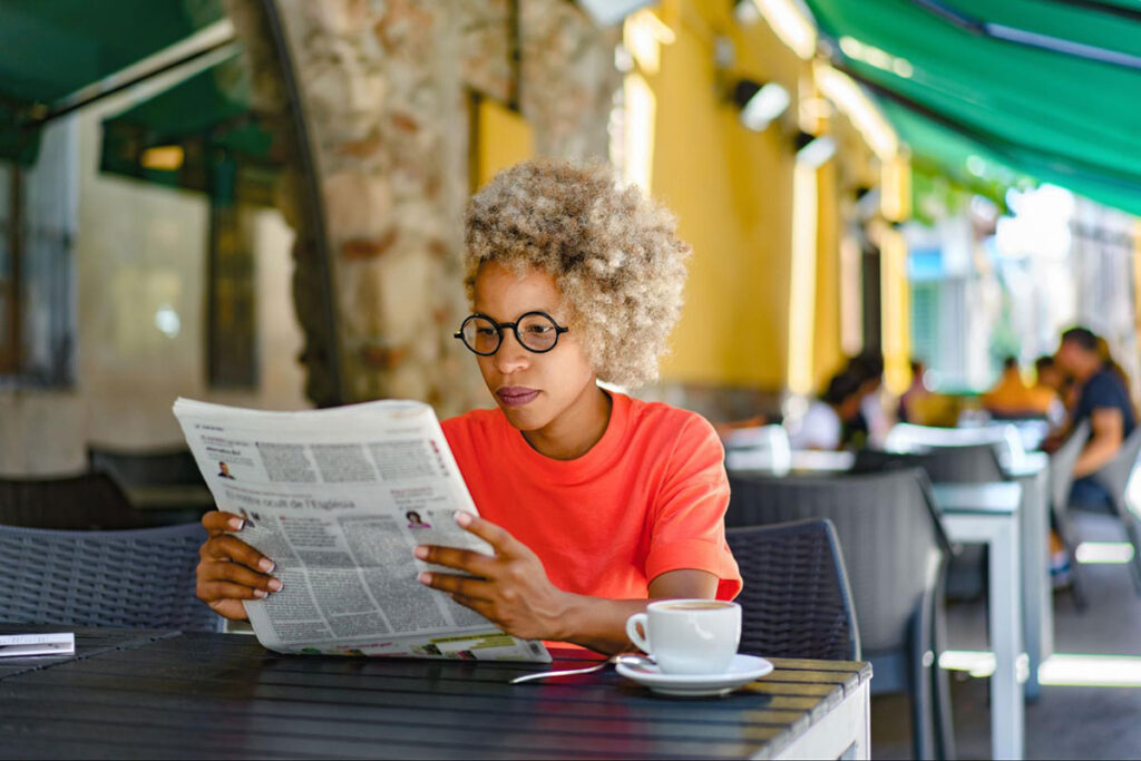 Woman reading the newspaper.